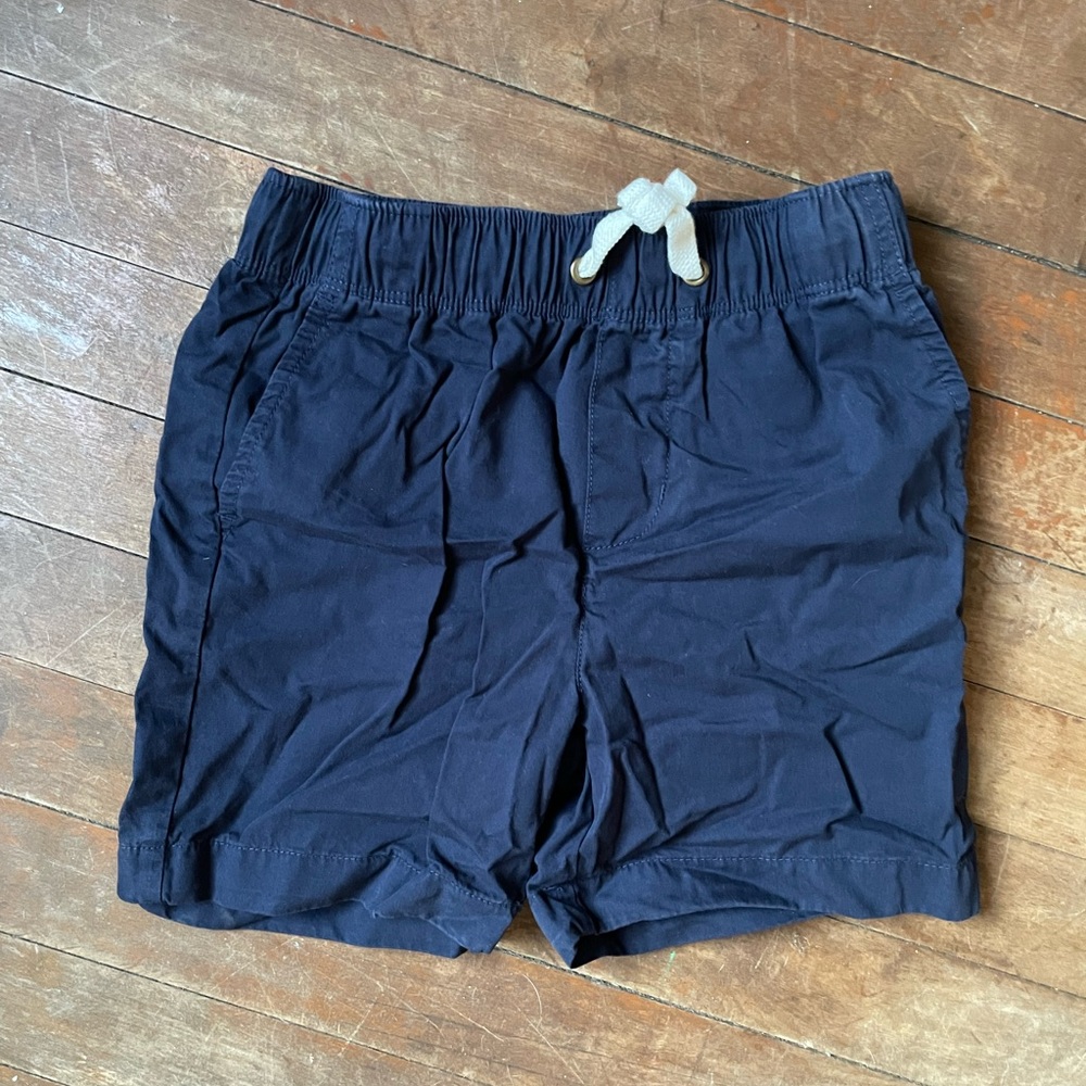 Lightly worn Crewcuts navy shorts size 7.